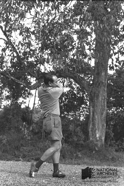 Dr Goh taking a swing shot at Bukit Club, Sime Road, 1965. Ref: 19980000605 - 0030